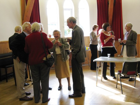 People enjoying a cup of coffee after the Harvest Thanksgiving Service